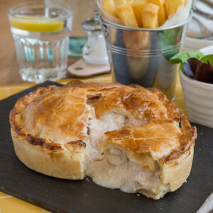 large chicken and ham pie