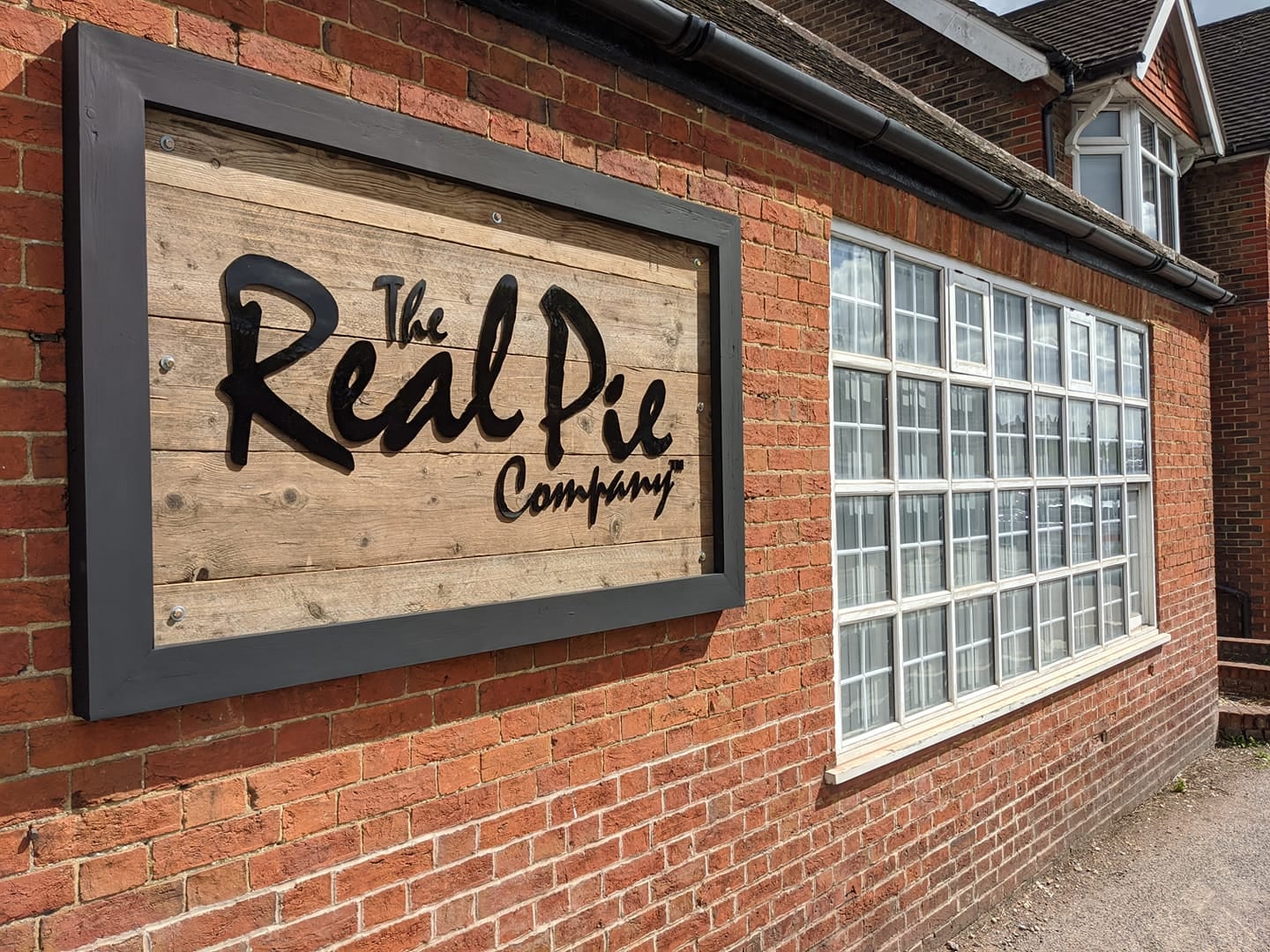 shop with the real pie company logo